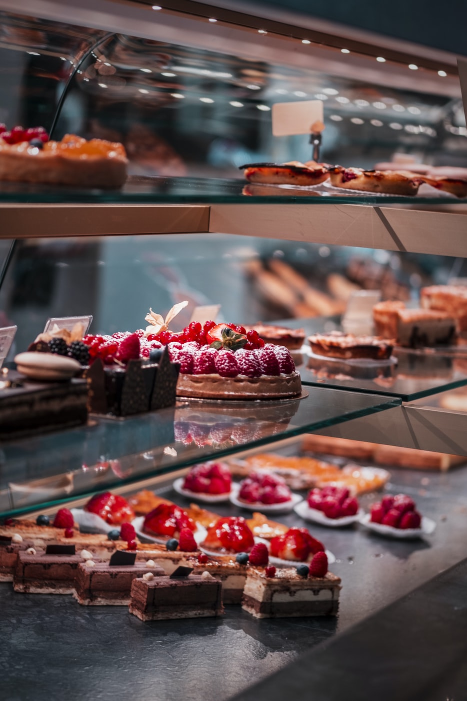 Various Types of Cakes Displayed at a Bakery